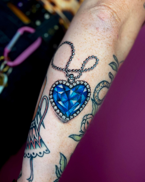 2026 tattoo trends nostalgic themes  titanic heart of the ocean necklace tattoo